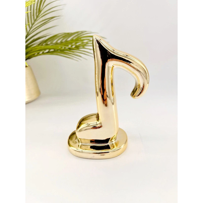 Note de musique en céramique doré