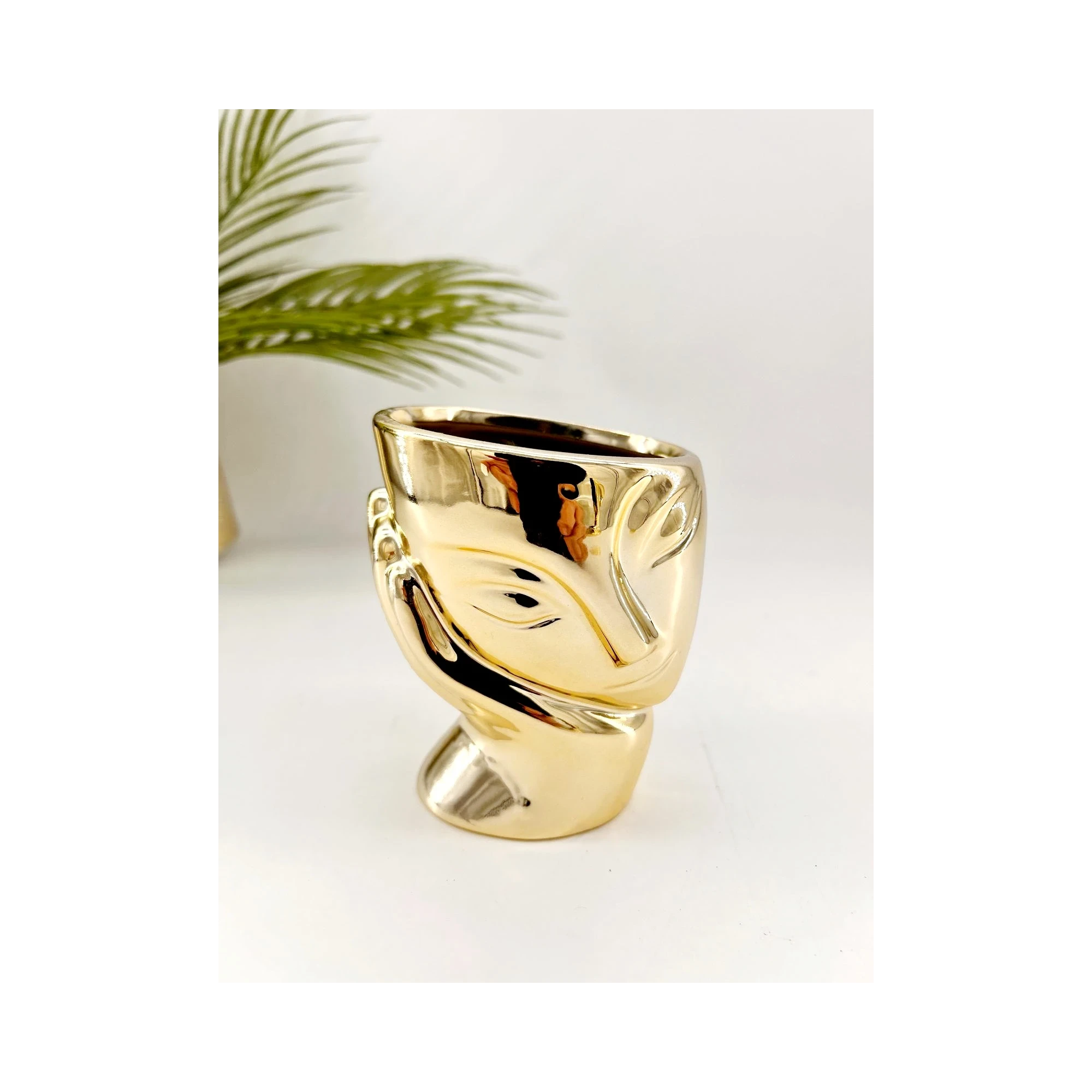 Visage décoratif en céramique